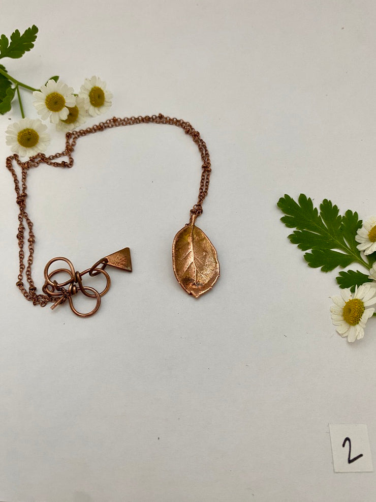 real oak leaf necklace encased in recycled copper infinity clasp simple wealth art made in usa electroplated oak leaf