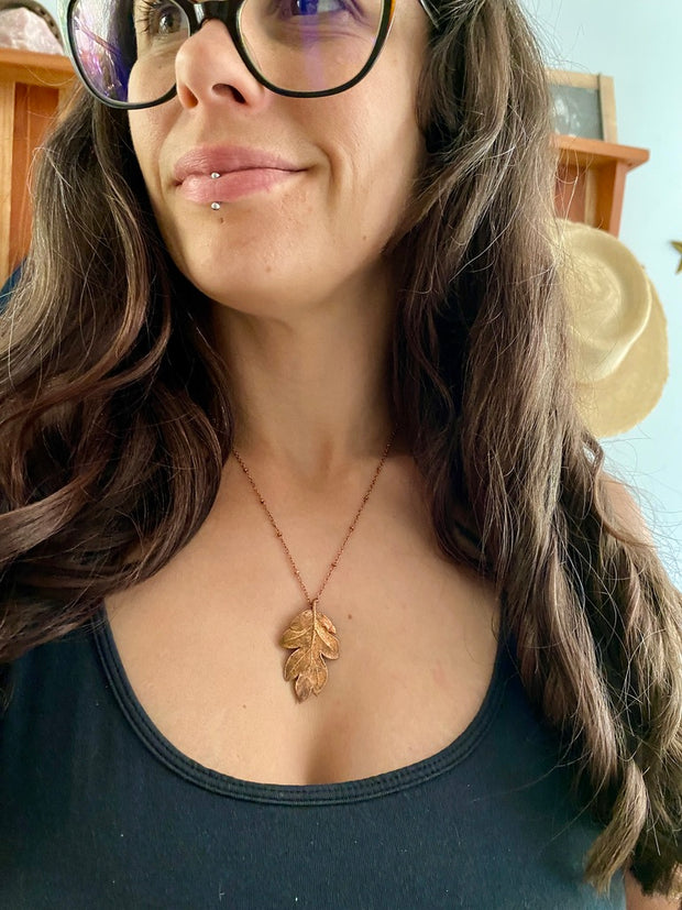 real oak leaf necklace encased in recycled copper infinity clasp simple wealth art made in usa electroplated oak leaf