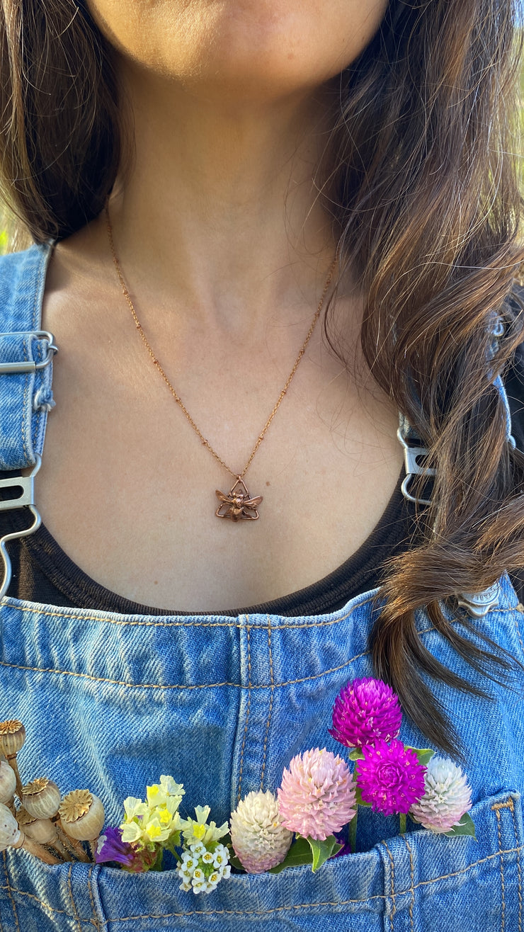 recycled copper electroplated bug rodent necklace wall hanging skull and plant creepy jewelry crystal made in usa simple wealth art