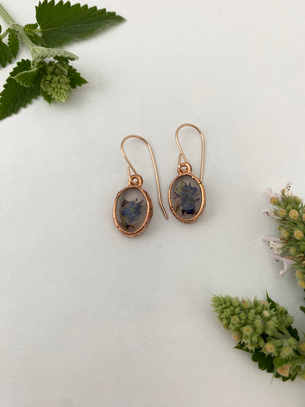 Tiny world earrings recycled copper electroplated ceanothus dried flower resin 12 karat rose gold