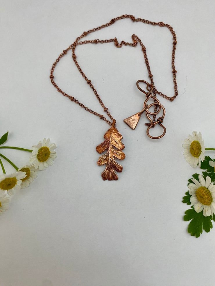 real oak leaf necklace encased in recycled copper infinity clasp simple wealth art made in usa electroplated oak leaf