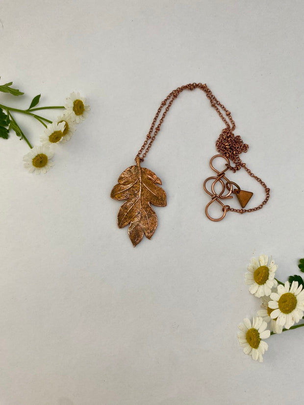 real oak leaf necklace encased in recycled copper infinity clasp simple wealth art made in usa electroplated oak leaf