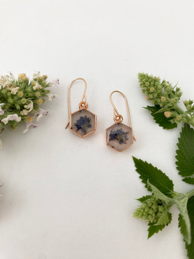 Tiny world earrings recycled copper electroplated ceanothus dried flower resin 12 karat rose gold 