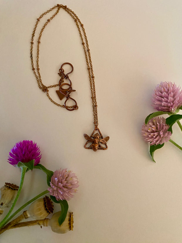 recycled copper electroplated bug rodent necklace wall hanging skull and plant creepy jewelry crystal made in usa simple wealth art